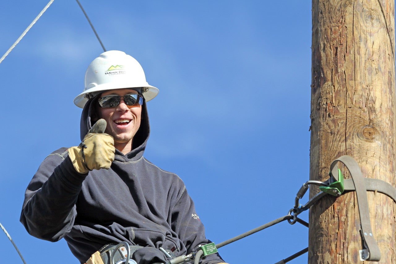 Jared - Lineworker climbing utility pole